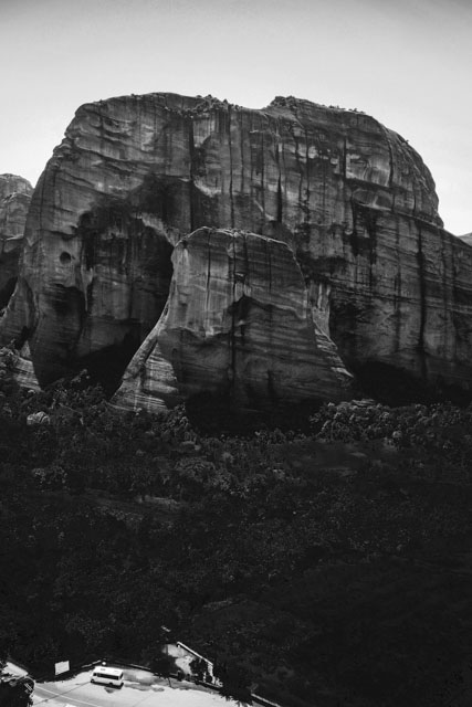 Meteora “suspended in air”, Greece, by Kathryn Minogue-Nachison. During the 11th to 20th centuries, monks inhabited these sandstone cliffs of Thessaly. Though accessible only by rope ladders and pulley nets, they carved out niches in the faces of the mountains and built over 20 monasteries at the peaks. From the St. Nikolaus Monastery, one of the cavernous dwellings can still be seen (on the left). Meteora is one of the most visually stunning sacred spaces of the Greek world.